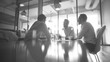 © atitaph - Blurred image of business team, office meeting, professional discussion in office room with bokeh lights.