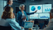 © atitaph - Middle-aged business woman presents data analysis panel on TV screen in meeting with business groups in conference rooms, training and workshops with senior managers, leaders, CEOs