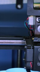 Wall Mural - Close-up of moving machine in 3d printer. Media. Creating objects on 3D printer with machine. Process of operation of 3d printer machine during printing