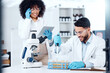 © peopleimages.com - Happy, teamwork and experiment in laboratory for science, research and ppe for planning. Man, woman and tablet for results or dna for healthcare with collaboration and investigation in hospital