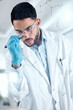 © peopleimages.com - Glass wall, planning and man in laboratory for science, research and strategy for experiment. Writing, ppe and scientist or expert for healthcare, wellness and development for pharmaceutical company