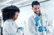 © peopleimages.com - Man, woman and ppe in laboratory for science, research and healthcare or experiment. Scientist, happy and gloves for teamwork or investigation, development and medical worker in clinic or hospital