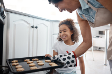 Poster - Grandmother, child and teaching in kitchen with baking tray, development and bonding for motor skills. Girl, cookies and pride in home, learning and growth with happiness, joy and creative ability