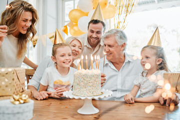 Wall Mural - Love, party and family to celebrate birthday in home, support and happiness at event for cake. People, generations and proud of milestone, bonding and love for growing girl, parents and grandparents