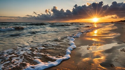 the sun shines brightly over the ocean on a sandy beach