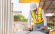 © Poguz.P - Engineer man inspects and plans projects in the factory site, Foreman worker working at construction site