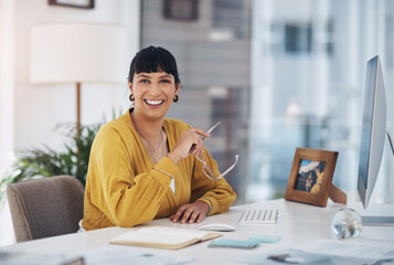 Poster - Business woman, notebook and computer in office for job, company and planning with confident smile. Female person, portrait and glasses in workplace for creative agency, design as graphic designer