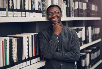 Poster - Smile, professional and portrait of architect in office with information books by shelf at startup. Happy, pride and confident black man with architecture career working on industrial design project.