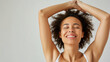 © Olga - Laser hair removal for underarms, woman with hands raised, confident and happy, clean and smooth skin