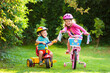 © famveldman - Two children riding bikes