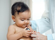 © KayJoint/peopleimages.com - Baby, stethoscope and hands of doctor in clinic for check up, development and progress for growth. Child, pediatrician and curious of equipment for post natal assessment, healthcare and cardiology