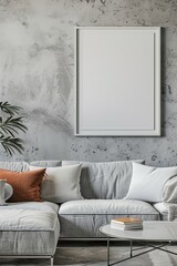 Sticker - Stylish modern living room featuring a large blank picture frame, comfy gray sofa with cushions, and plant decor, embodying minimalism and comfort.