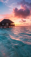 Sticker - A breathtaking view of a sunset over an overwater bungalow, with serene blue ocean and vibrant sky, providing a peaceful and stunning retreat experience.