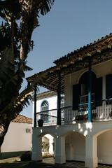 architecture of a historic mansion on a farm. White walls, blue doors and windows that demonstrate its beauty.