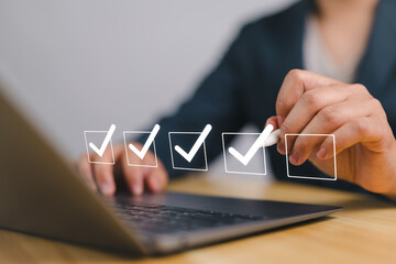 Poster - Checklist concept. Businessman using laptop. Checking mark on checkboxes.