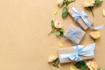 Wall Mural - Gift boxes and flowers on beige background