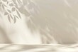 © chesleatsz - Minimalist background with sunlight and leaf shadows on wall. Empty podium for product placement. Concept of natural beauty, cosmetics display, and wellness.