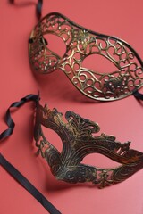 two beautiful carnival masks on red background