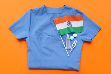 Poster - Doctor's uniform with contact lenses, solution and flag of India on orange background. National Doctor's Day celebration