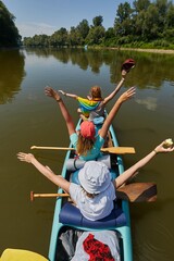 canoeing on a river, girls in the boat