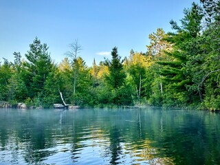 morning fog over peaceful lakeshore. grand rapids minnesota