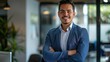 © 4​Creations Photo  - Smiling elegant confident young professional Latino Hispanic business man , male proud leader, smart Latin businessman lawyer or company manager executive looking at camera standing in office.