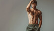 © Alienmonster Images - Fitness portrait of a muscular man showcasing a toned physique and confidence against a neutral background
