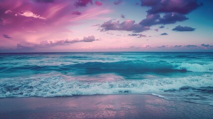 Tranquil beach at dusk with soft waves and a beautiful gradient of colors in the sky from pink to deep blue