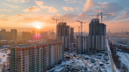 Construction site. Built new high-rise residential building. Top aerial drone view. Big high crane. Property in a residential area. Mortgage concept. Housing industry. Real estate.