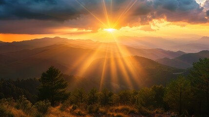 Wall Mural - Majestic sunrise with sun rays over a mountain range