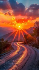 Wall Mural - Scenic mountain road at sunset with golden rays