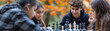 © doraclub - Students Strategizing Over Chess Game on Autumn Tinged Picnic Table
