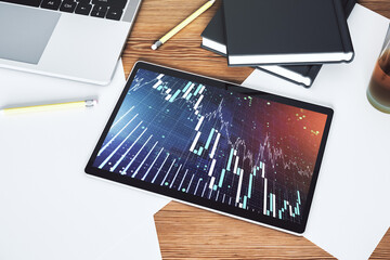 Poster - Modern digital tablet monitor with abstract creative financial chart, research and strategy concept. Top view. 3D Rendering