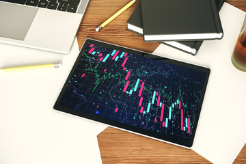 Poster - Top view of modern digital tablet monitor with creative abstract global crisis chart and world map hologram. Financial crisis and recession concept. 3D Rendering