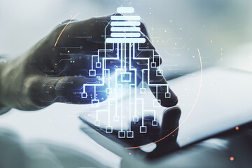 Poster - Creative light bulb with chip hologram and hand working with a digital tablet on background, artificial Intelligence and neural networks concept. Multiexposure