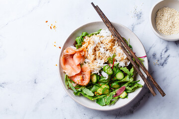 Wall Mural - Poke salad - salmon with rice and cucumber.