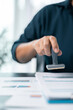 © doidam10 - Businesswoman confidently placed her stamp of approval on legal document, finalizing the contract and solidifying the agreement in office with her authority. document, approve, business, stamp.