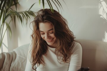 Wall Mural - Smiling Woman with Long Hair, Casual White Blouse, Indoor Setting with Plant