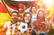 © karepa - Group of enthusiastic German soccer fans celebrating the victory