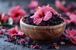 © Graph Squad - A bowl of tea leaves with a pink flower on top