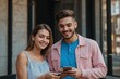 © PixaVerse Studio - Young happy couple two friends family man woman wear pink blue casual clothes together hold in hand use looking at mobile cell phone