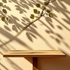 Wall Mural - Empty wood table top on beige wall texture with tree leaves shadow background