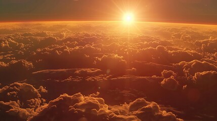 Wall Mural - sunrise over horizon with warm glow and cumulus clouds in picturesque astronomical event in space
