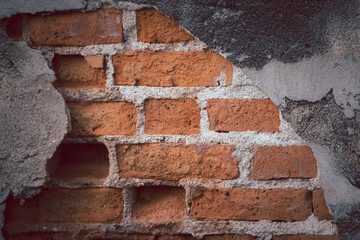 Wall Mural - A brick wall with a hole in it