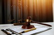 © Phanphen - Law theme, gavel or mallet of the judge, lawyer enforcement officers, evidence-based cases taken into account in the court abount business, legislation.