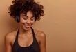 © MD - Smiling Young Woman with Curly Hair Wearing Headphones