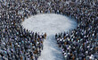 © Photocreo Bednarek - Large crowd of people forming way to circle in open space