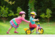 © famveldman - Two children riding bikes