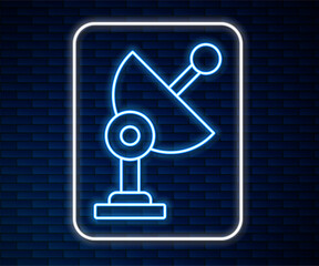 Poster - glowing neon line radar icon isolated on brick wall background. search system. satellite sign. vecto
