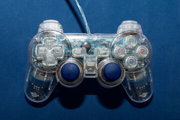 Game joystick. Gamepad for the console on blue background